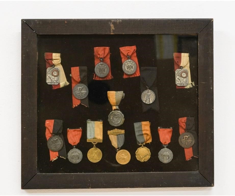 Appraisal: Fourteen framed bronze metal track medals with grosgrain ribbon circa