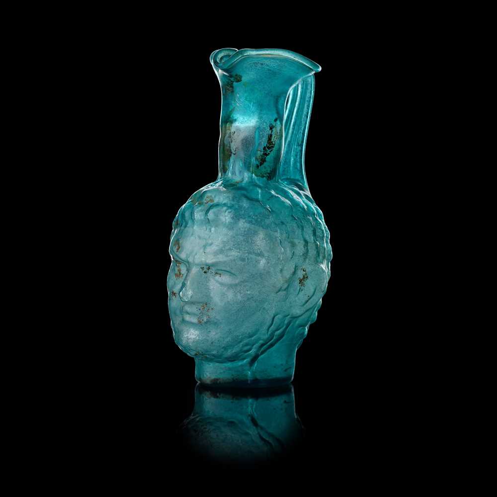 Appraisal: ROMAN STYLE PORTRAIT GLASS VESSEL AFTER THE ANTIQUE mould-blown in