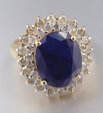 Appraisal: CT SAPPHIRE WITH DIAMONDS RING K yellow gold ring contains