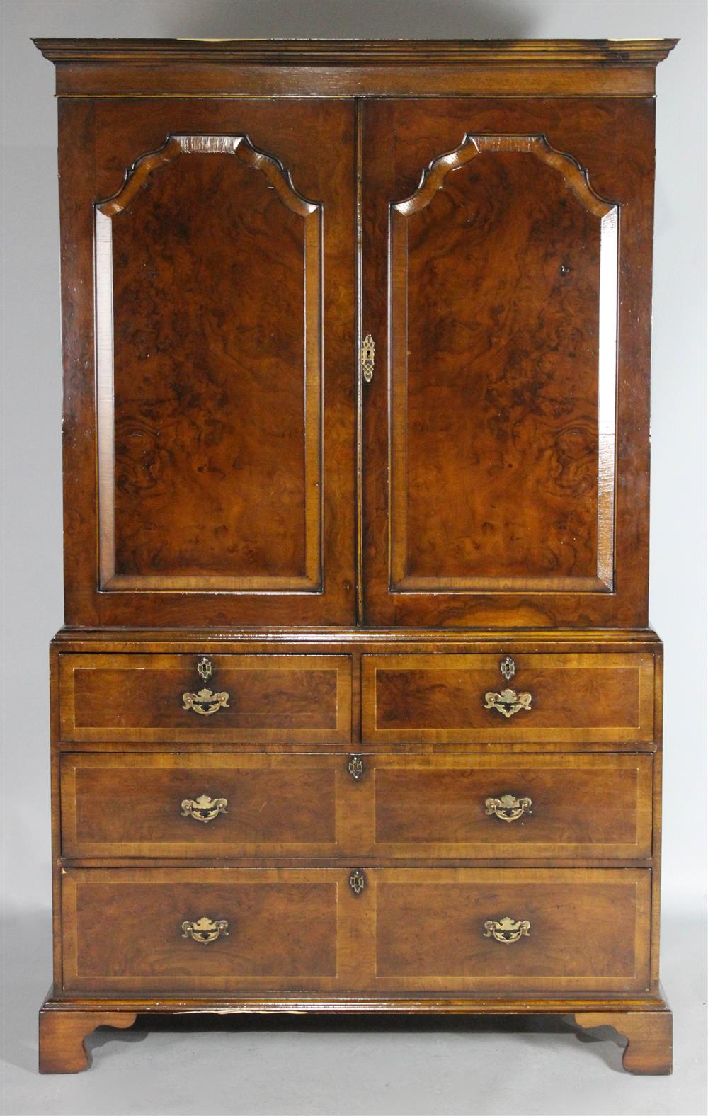 Appraisal: GEORGIAN STYLE WALNUT LINEN PRESS in three parts with an