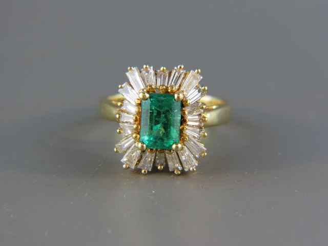 Appraisal: Emerald Diamond Ring carat emerald surrounded by tapered baguette diamonds