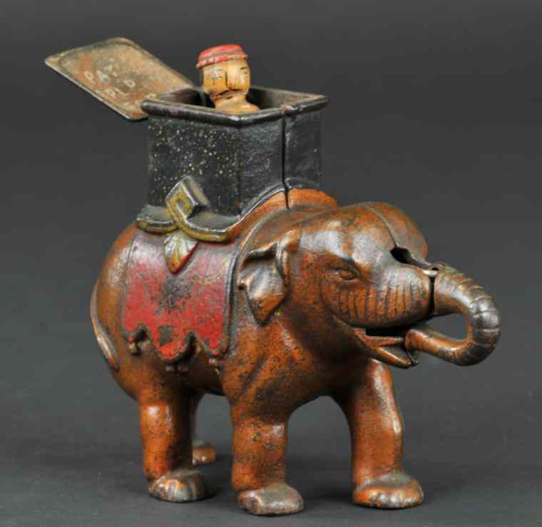 Appraisal: ELEPHANT HOWDAH MAN POPS OUT MECHANICAL BANK Enterprise Manufacturing Co