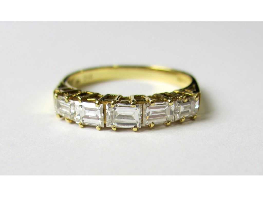 Appraisal: An eighteen carat gold five stone baguette diamond half hoop