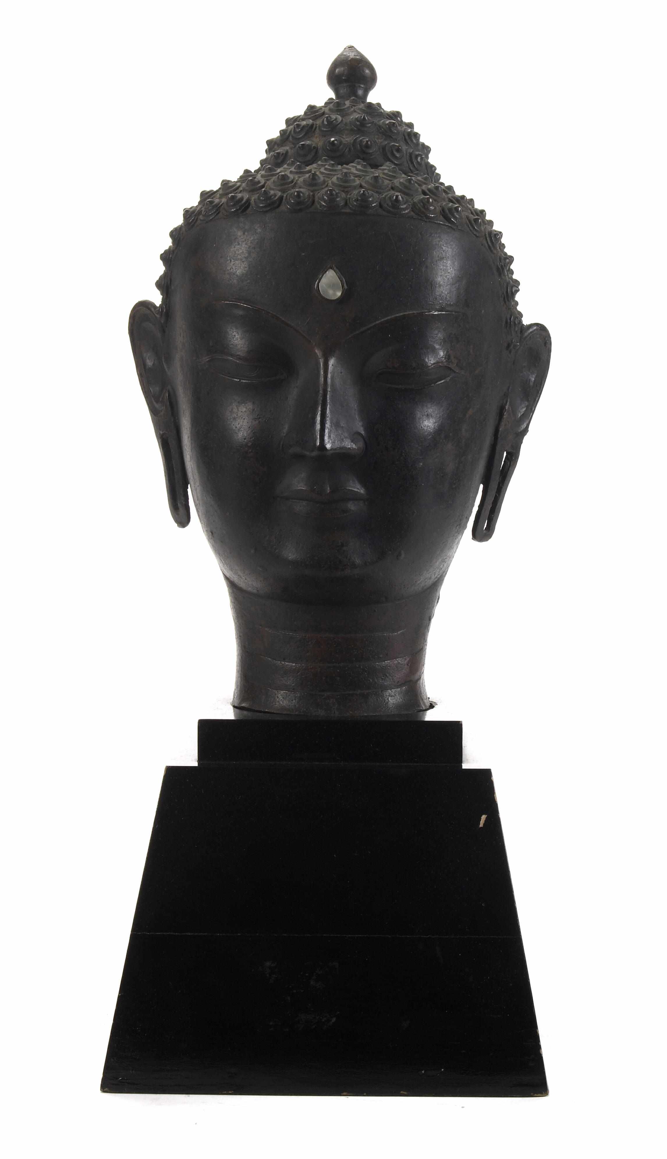 Appraisal: A Thai bronze inlaid urna head of Buddha with a