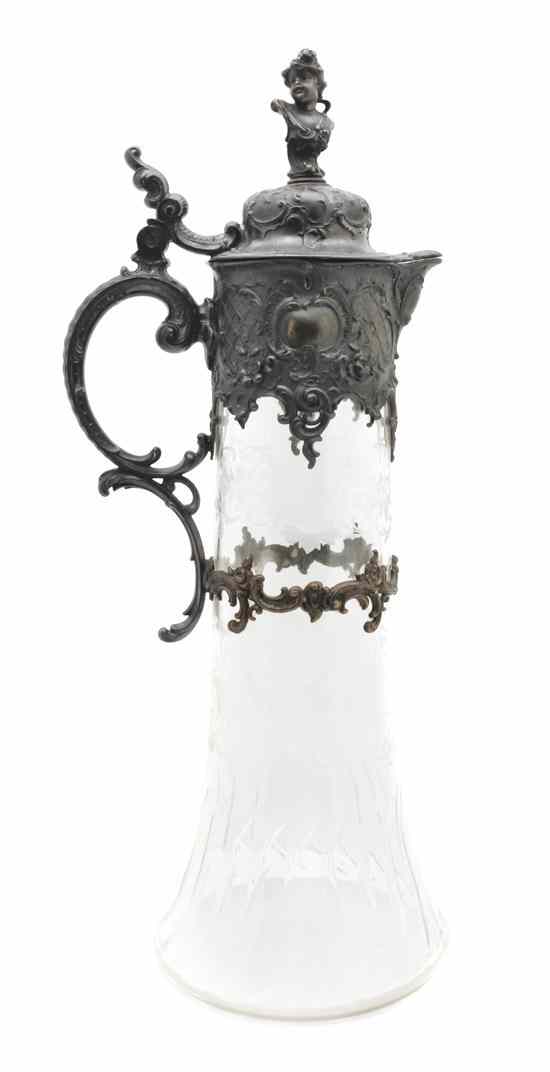 Appraisal: A Silverplate Mounted Cut Glass Pitcher having a putto finial