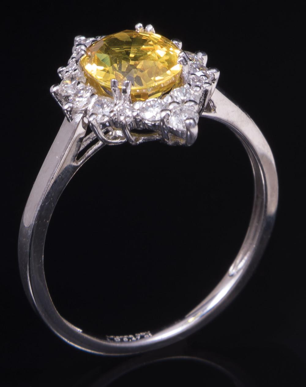 Appraisal: Platinum Yellow Sapphire and Diamond Ring center prong set oval