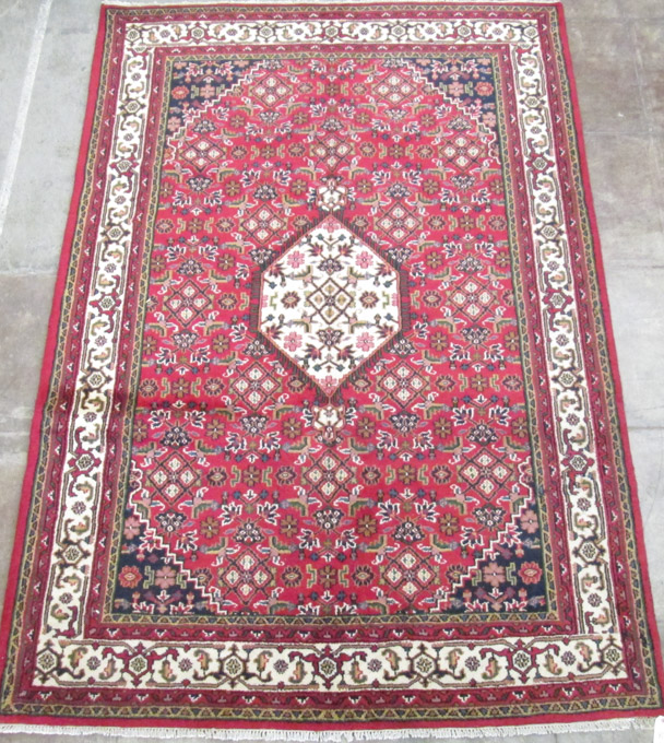 Appraisal: HAND KNOTTED ORIENTAL CARPET Indo-Persian Herati Bijar design with central