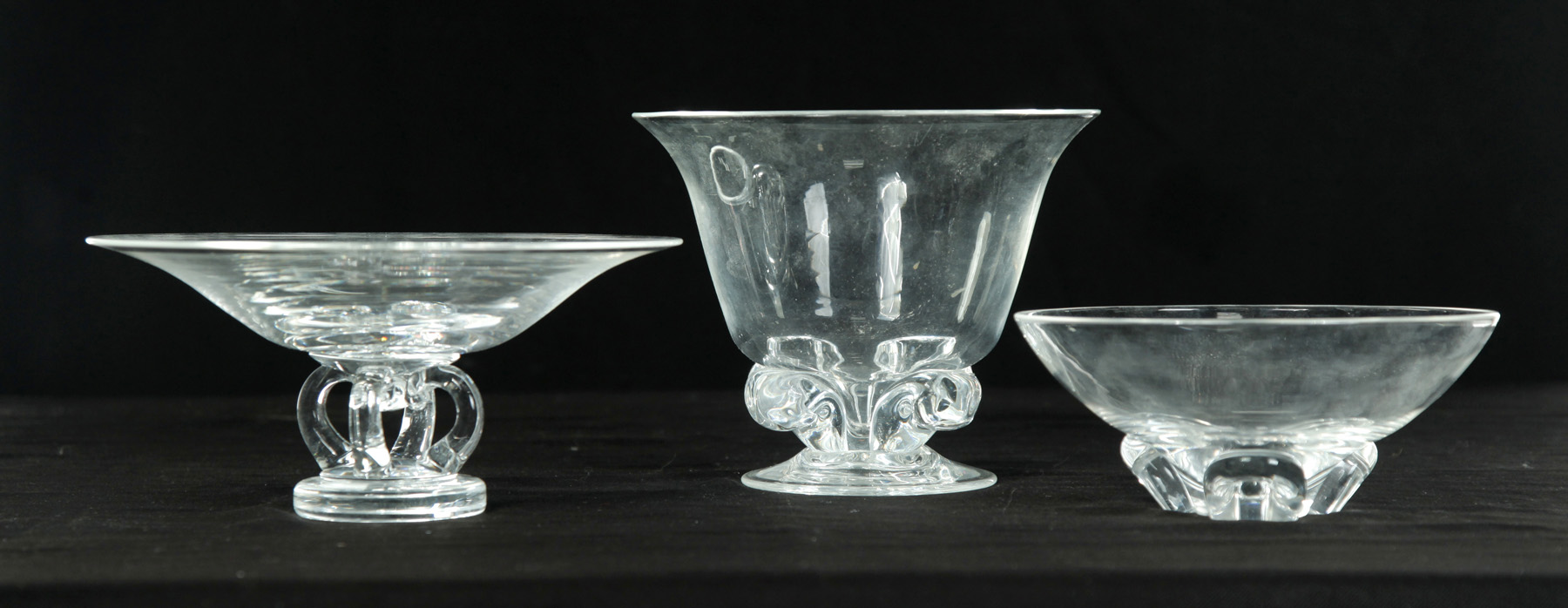 Appraisal: THREE SIGNED STEUBEN CLEAR GLASS FOOTED BOWLS American nd half-