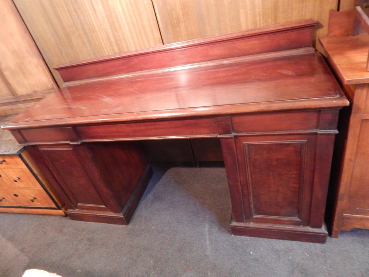 Appraisal: A Victorian mahogany pedestal sideboard the top with a raised