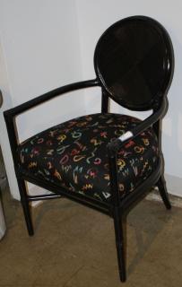 Appraisal: Contemporary black bamboo style arm chair with wild upholstery Contemporary