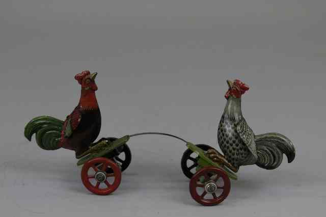 Appraisal: FIGHTING ROOSTERS ON PLATFORM TOY Attributed to Einfalt Germany lithographed