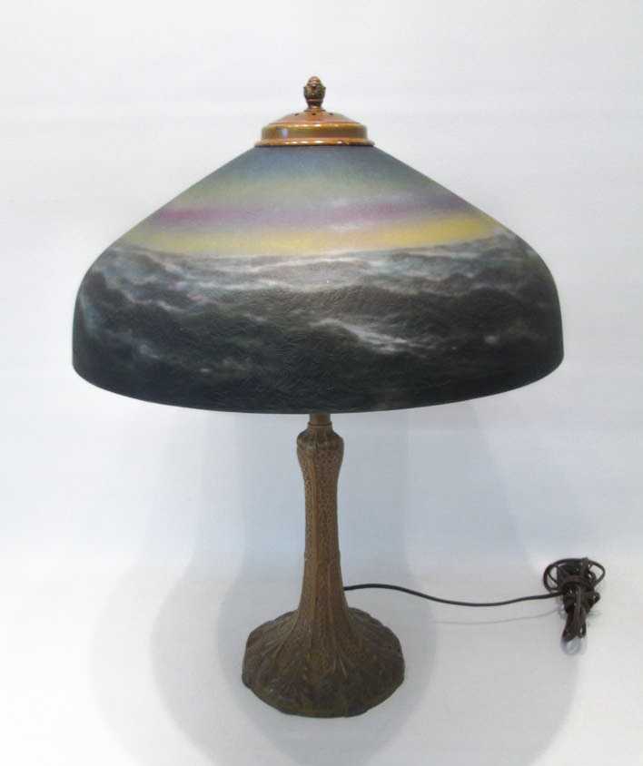 Appraisal: REVERSE PAINTED TABLE LAMP the glass shade painted with an