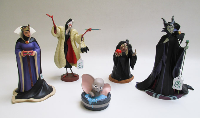 Appraisal: FIVE WALT DISNEY CLASSICS COLLECTION FIGURINES whiteware sculptures Maleficent Cruella