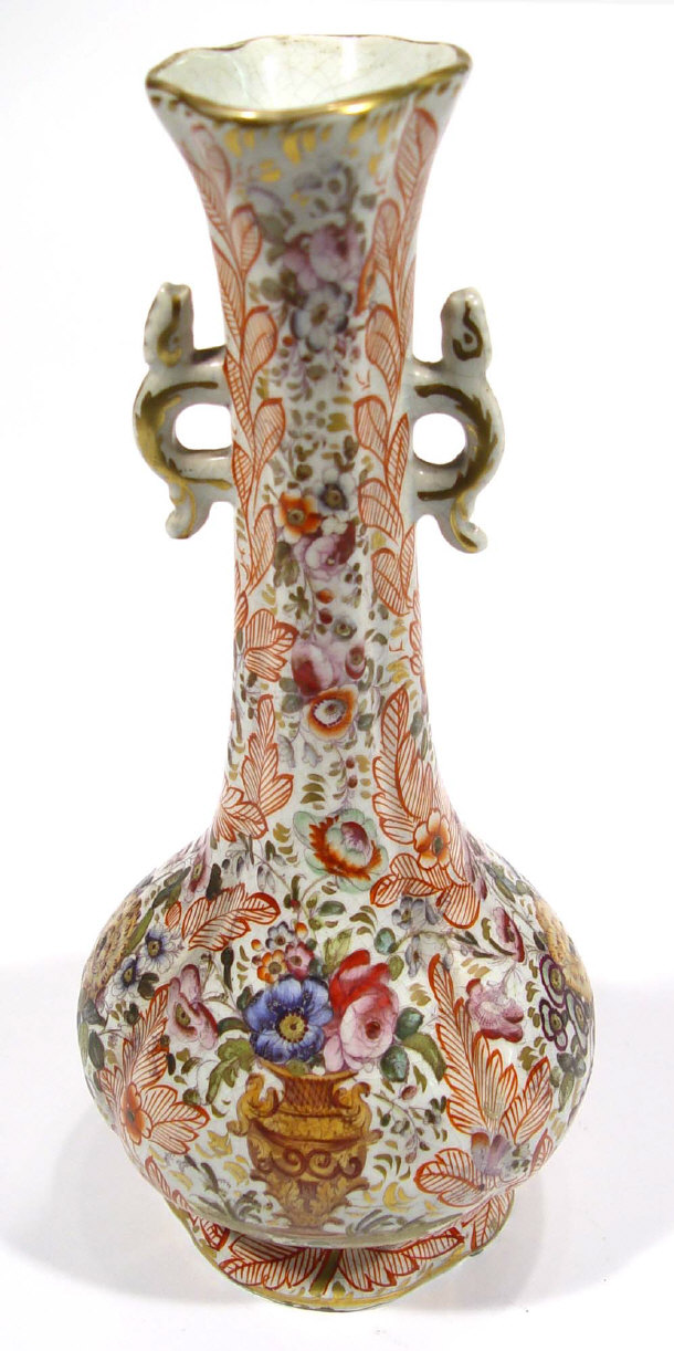 Appraisal: th Century fluted pottery vase profusely enamelled and gilded with