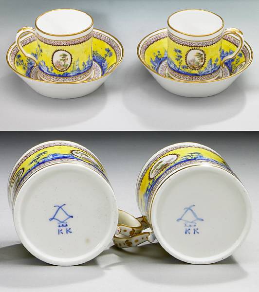 Appraisal: A pair of Sevres porcelain yellow ground coffee cans and