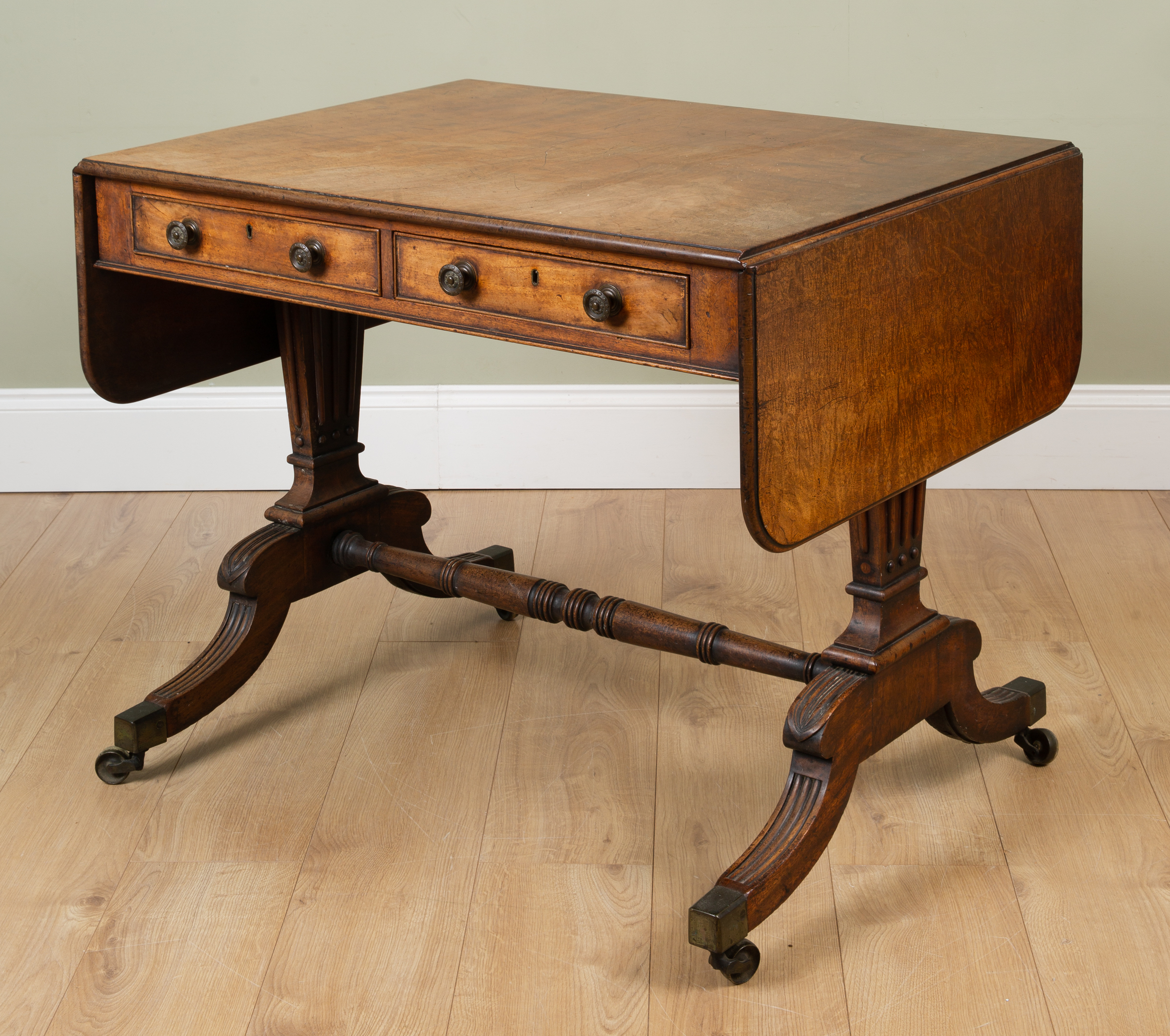 Appraisal: A George III mahogany sofa table the end supports and