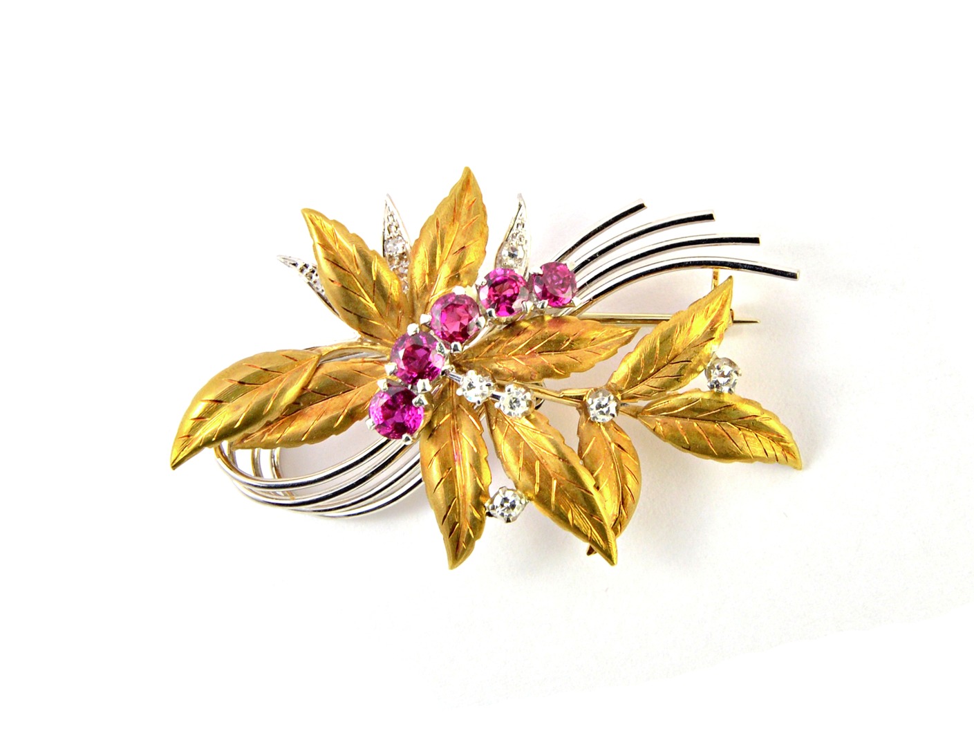 Appraisal: An ct two colour gold ruby and diamond set brooch