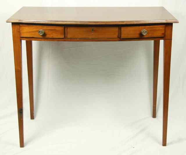 Appraisal: A th Century mahogany bowfront dressing table fitted three frieze