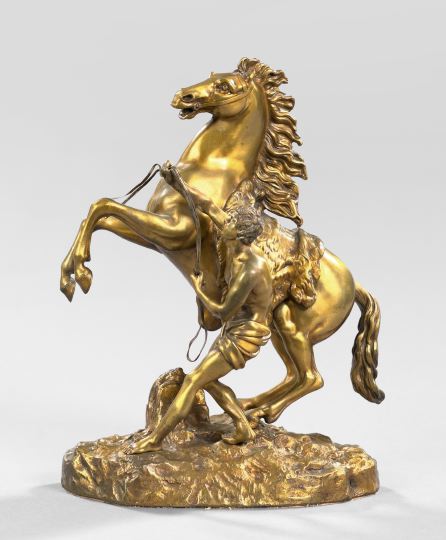 Appraisal: After Guillaume Coustou French - gilded bronze group of The