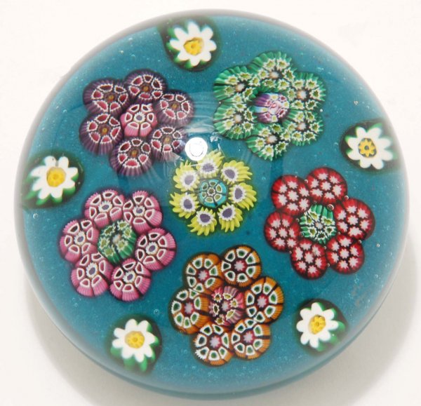 Appraisal: Millefiori paperweight Multicolor millefiori flowers on turquoise ground Green flower