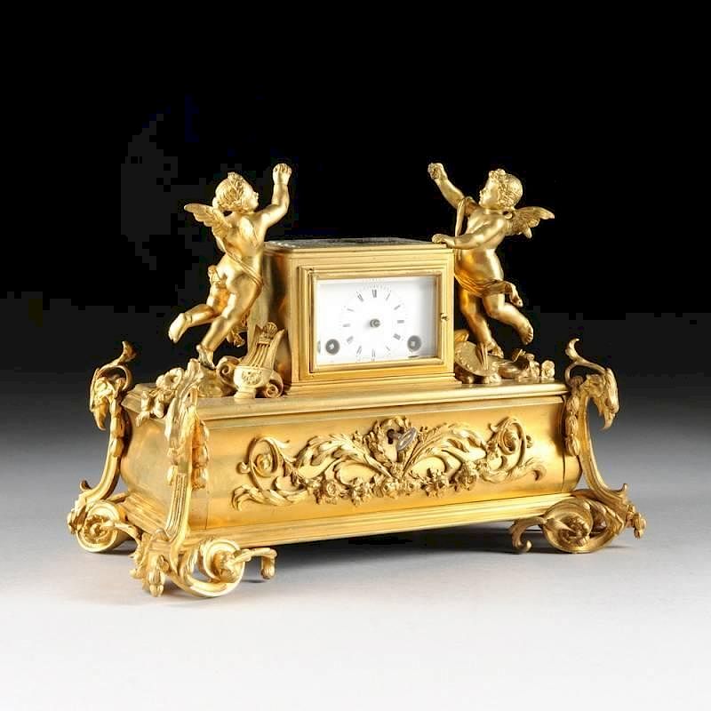 Appraisal: A NAPOLEON III GILT BRONZE FIGURAL CLOCK ENCRIER THIRD QUARTER