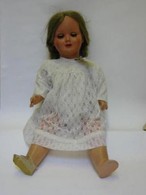 Appraisal: A mid th century plastic doll with sleeping eyes brown