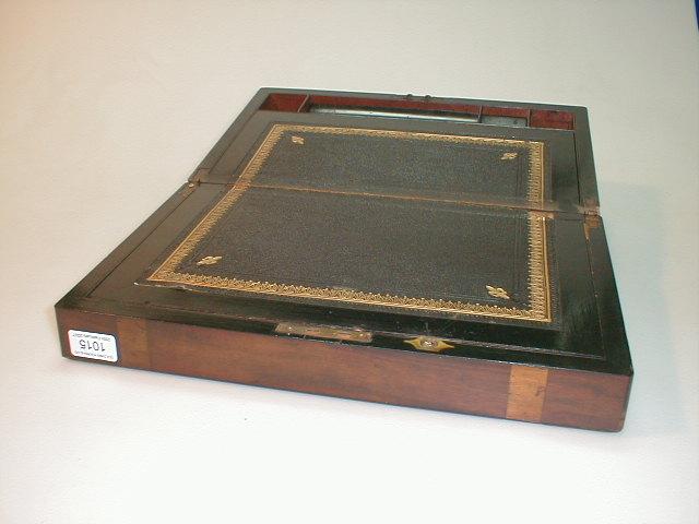 Appraisal: A Victorian rosewood brass banded writing box the cover with