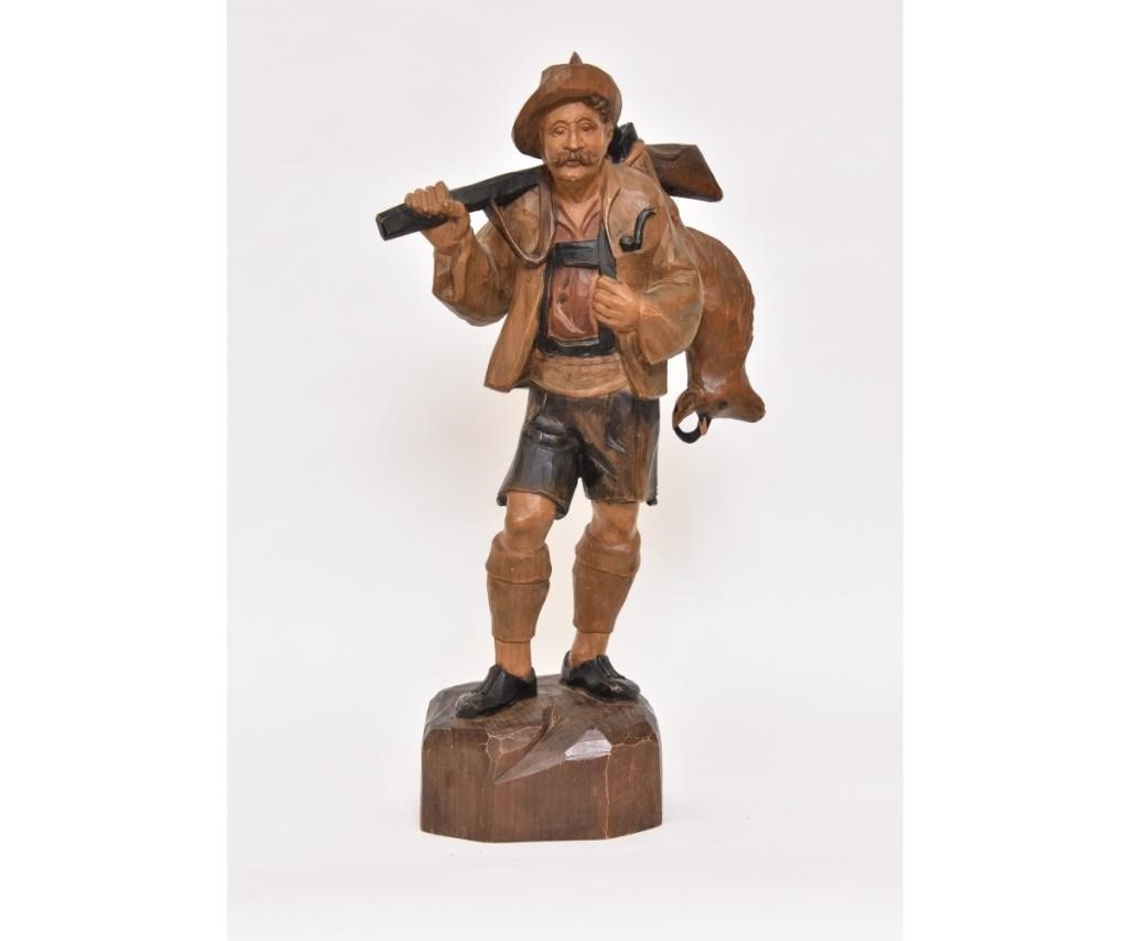 Appraisal: Black Forest carved huntsman wearing lederhosen signed and dated on