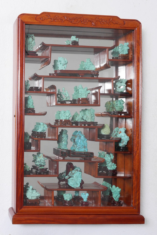 Appraisal: CARVED ORIENTAL CABINET WITH TURQUOISE CARVINGS Carved oriental motif wall