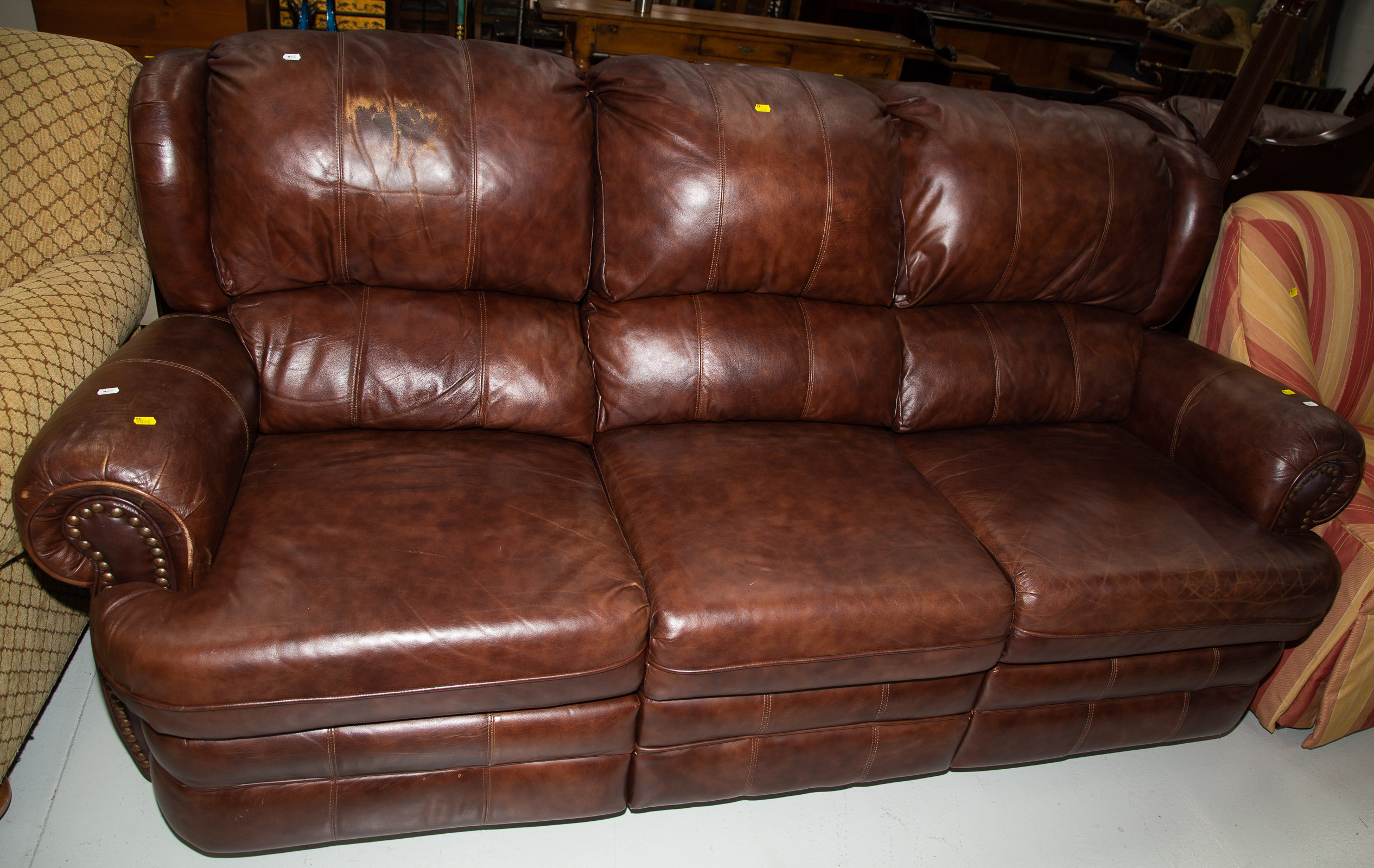 Appraisal: CONTEMPORARY LEATHER SOFA Two end seats recline