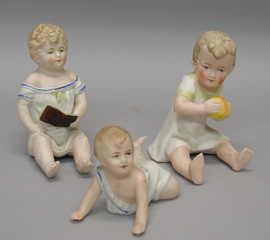 Appraisal: Lot of German bisque piano babies Unmarked Sitting child dressed