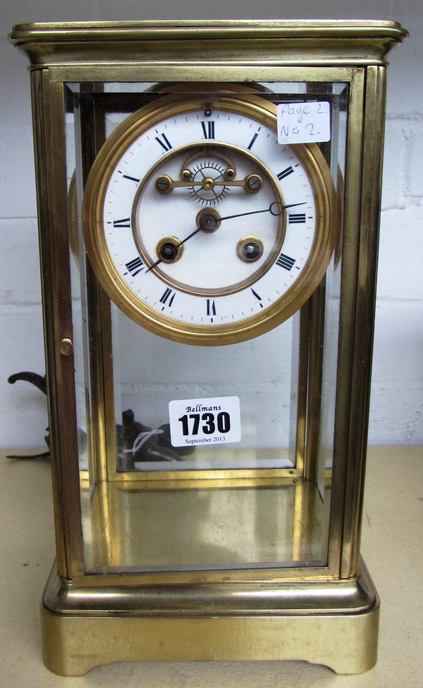 Appraisal: A brass cased four glass mantel clock th century with