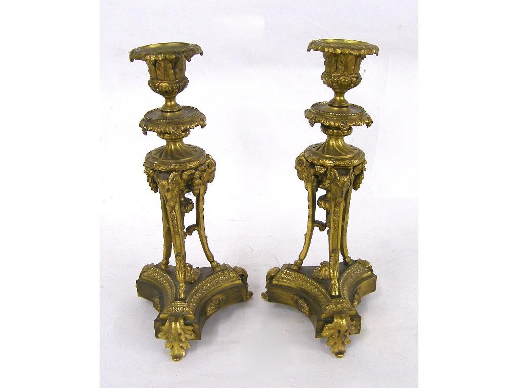 Appraisal: Pair of ormolu classical candlesticks with detachable sconces supported upon