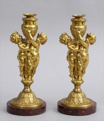 Appraisal: PAIR OF LOUIS XV-STYLE FIGURAL GILT-BRONZE CANDLESTICKS ON MARBLE BASES