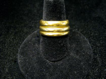 Appraisal: Three high karat yellow gold wedding bandsOne Tiffany Co karat