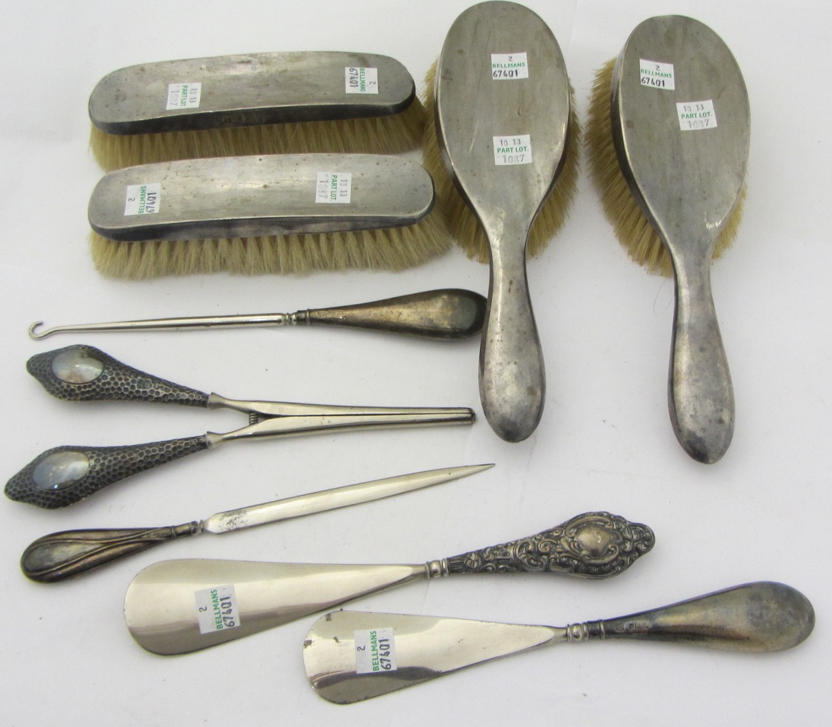 Appraisal: Silver and silver mounted wares comprising a pair of hairbrushes