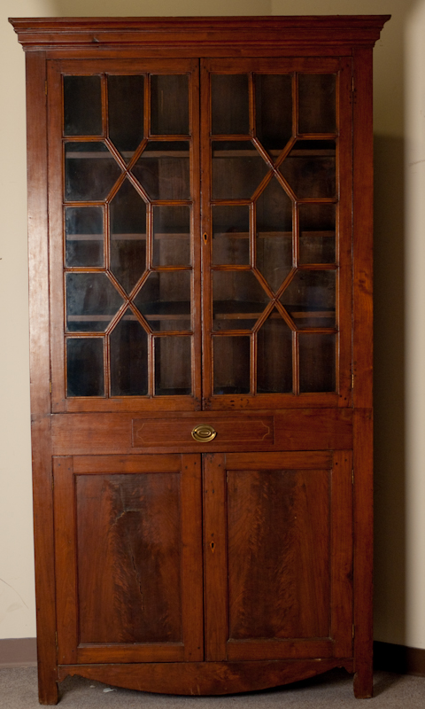 Appraisal: An E th C Mahogany One Piece Corner Cupboard with