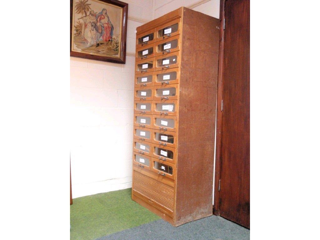 Appraisal: Light oak haberdashery shop display case furnished with glazed drawers