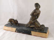 Appraisal: A spelter group of a lady kneeing on a cushion