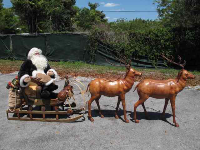 Appraisal: Santa Claus sleigh reindeer holiday display Includes Santa Claus figure