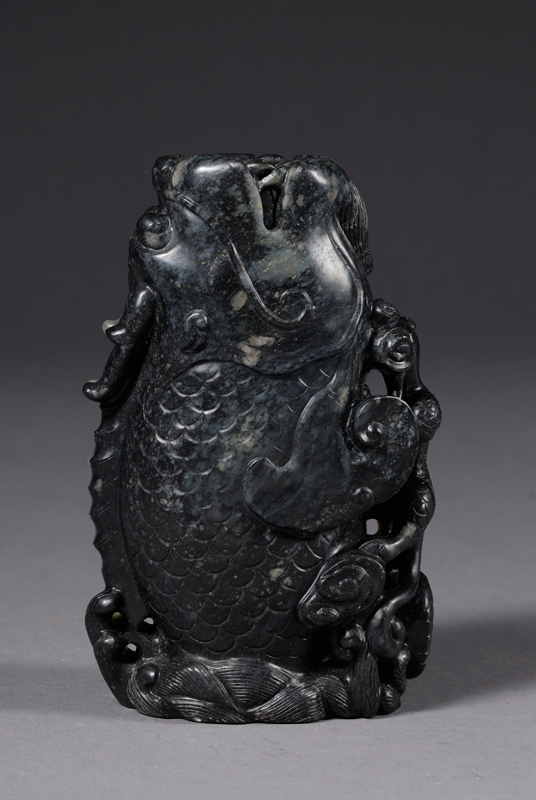 Appraisal: Carving of a Dragon Carp China stone of a black