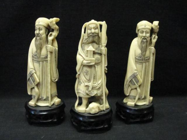 Appraisal: Ivory Figures on Carved Bases are a pair From a