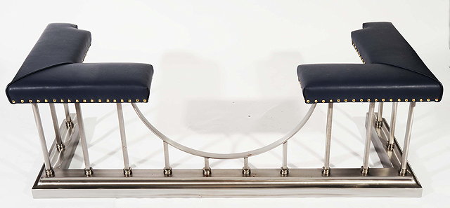 Appraisal: A BRUSHED STEEL AND BLUE LEATHER UPHOLSTERED ROCKINGHAM CLUB FENDER