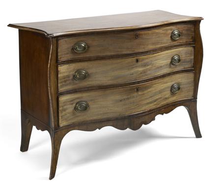 Appraisal: GEORGE III MAHOGANY SERPENTINE COMMODE IN THE MANNER OF JOHN