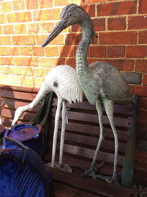 Appraisal: THREE OLD CAST METAL STATUES two cranes and a heron