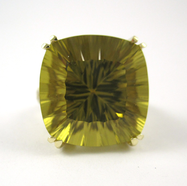 Appraisal: LEMON CITRINE AND FOURTEEN KARAT GOLD RING with round-cut diamonds