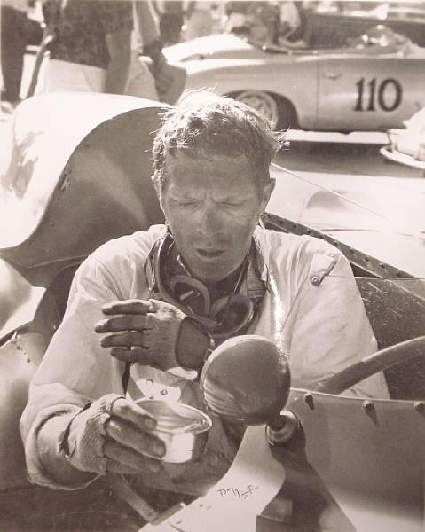 Appraisal: A post-race photograph of Steve McQueen in a Lotus racecar