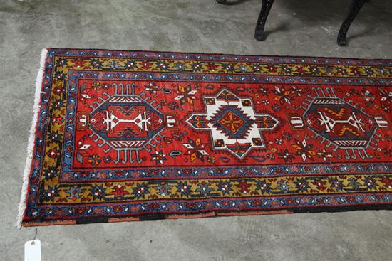 Appraisal: ORIENTAL STYLE RUNNER Red ground with yellow and blue borders