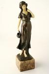 Appraisal: BRONZED FIGURE - Circa bronzed spelter figure of woman holding