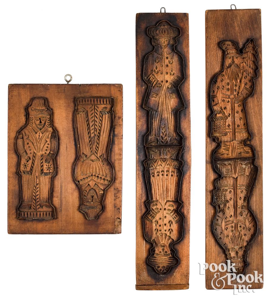 Appraisal: Three Dutch carved cakeboards th c with figur Three Dutch